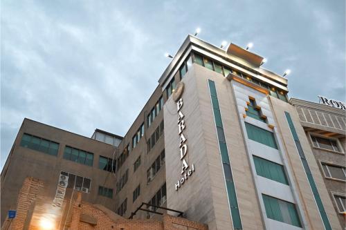 a building with a sign on the side of it at BARADA Hotel- فندق بردى in Qaryat al Bulush