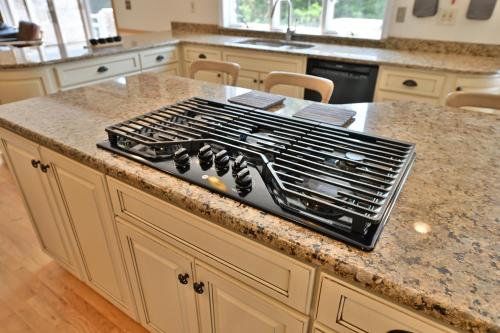 a stove top oven sitting on top of a kitchen counter at Farmhouse in Hershey in Hershey