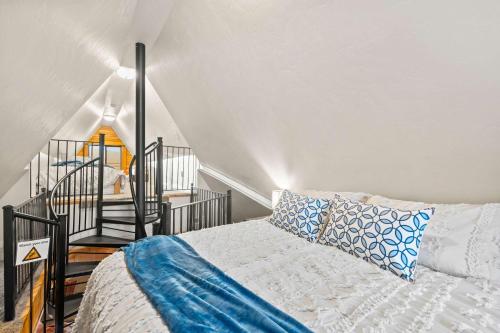 a bedroom with a bed and a stair case at Evy's Family Ranch Cabin Secluded in Heber City
