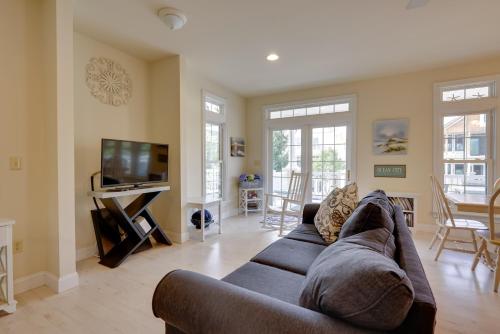 a living room with a couch and a tv at Sunny Ocean City Retreat about Qtr-Mi to Beach! in Ocean City