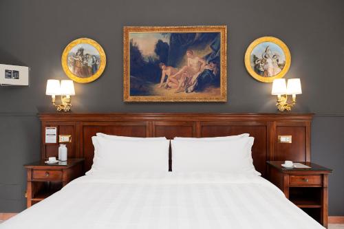 Ένα ή περισσότερα κρεβάτια σε δωμάτιο στο Hotel Des Artistes Roma