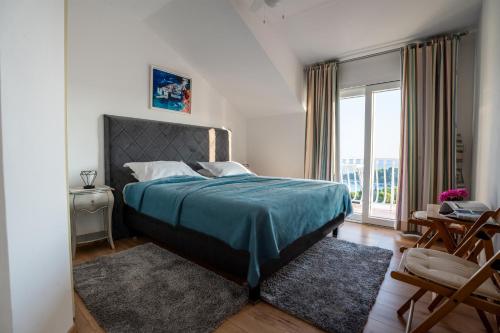 Ένα ή περισσότερα κρεβάτια σε δωμάτιο στο Andrijana Apartments