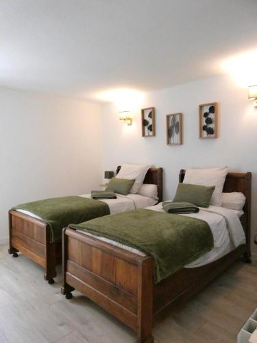 Postel nebo postele na pokoji v ubytování Le Gîte du Chêne Rouvre