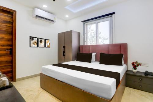 Ένα ή περισσότερα κρεβάτια σε δωμάτιο στο Hotel O Sukun Villa