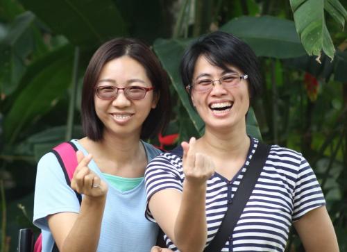 two women giving the thumbs up sign at Pearl Spot in Alwaye