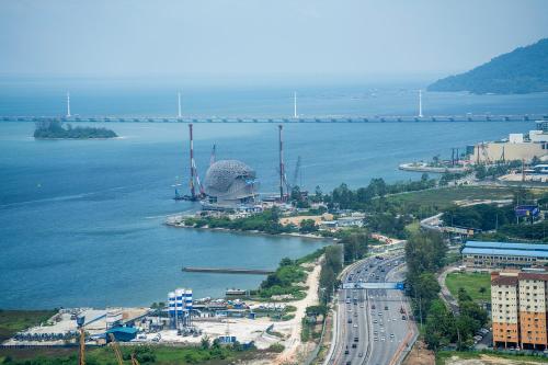 an aerial view of a city with a bridge over a river at Seaview Urban suites Georgetown @Penang in Jelutong