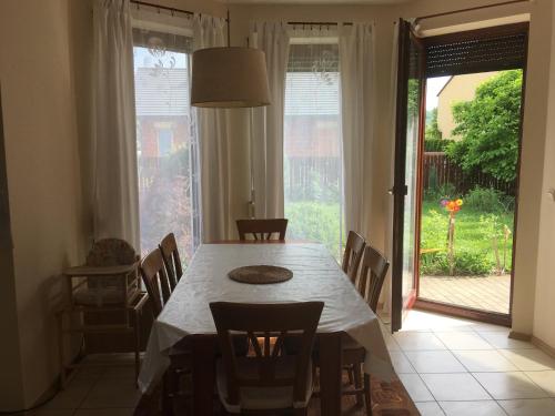 a dining room with a table and chairs and a window at Holiday Home in Dobczyce near Ski Lift in Dobczyce