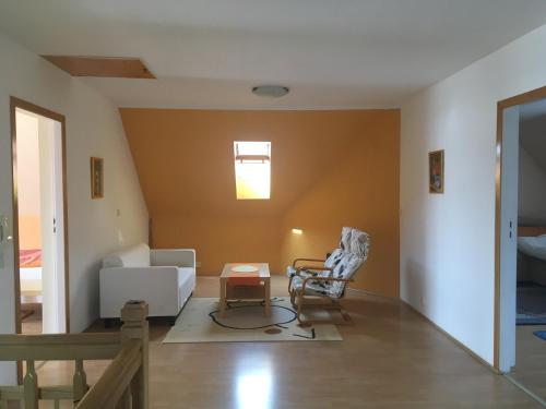 a living room with a couch and a chair at Holiday Home in Dobczyce near Ski Lift in Dobczyce