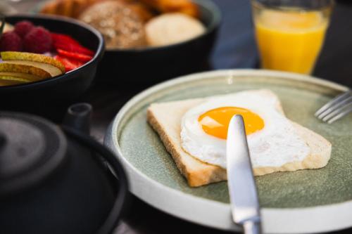 a breakfast plate with an egg on top of toast at Radisson Blu Hotel, Lucerne in Luzern