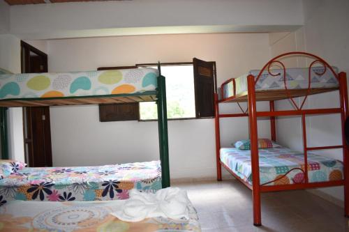 Cama o camas de una habitación en hotel bocas del cauca