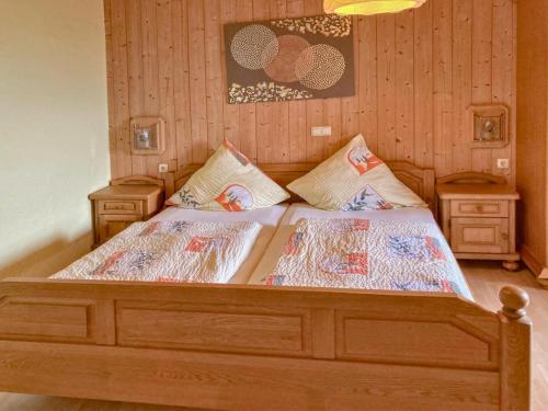 a bedroom with two beds and two night stands at Traudi in Waldkirchen
