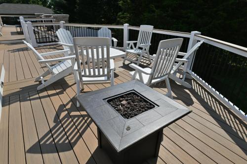 a group of chairs and a table on a deck at Farmhouse in Hershey in Hershey