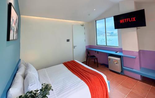 Ένα ή περισσότερα κρεβάτια σε δωμάτιο στο Joi Home Beachfront