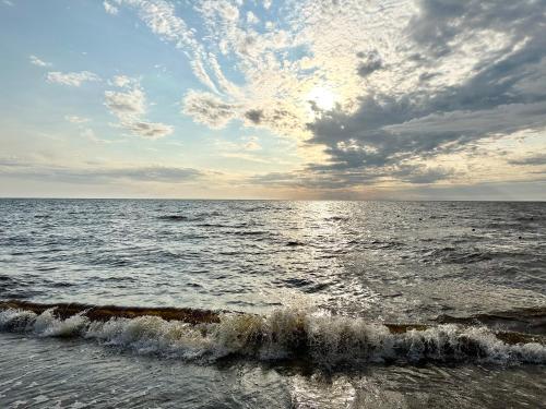 a view of the ocean from the beach at Villa Gāles Hotel in Saulkrasti