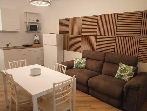 a living room with a couch and a table at Sweetpalermo in Palermo