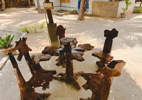 a bunch of wooden crosses sitting on the street at Skykite Resort & Hostel Kalpitiya Sri Lanka in Kalpitiya
