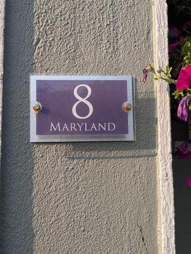 a sign on the side of a building at Station Road Homestay in Castlebar