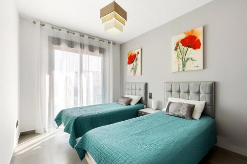 Ένα ή περισσότερα κρεβάτια σε δωμάτιο στο Punta Prima Oasis Beach Fase 9