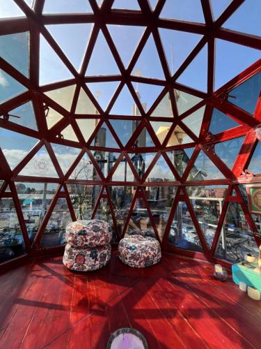 two chairs sitting on the floor of the eiffel tower at Mandala Yoga Hostel in Bogotá
