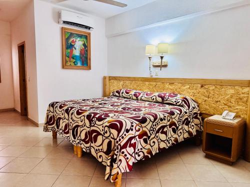 a bedroom with a bed in a room at Tropicana Hotel Puerto Vallarta in Puerto Vallarta