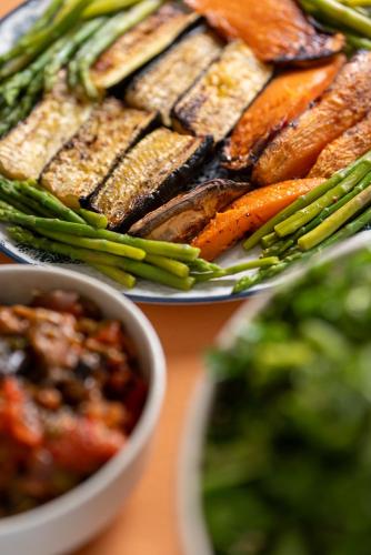 two plates of food with vegetables on a table at Casa d'Amares in Amares