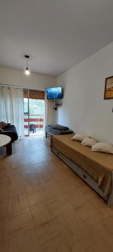 Ένα ή περισσότερα κρεβάτια σε δωμάτιο στο Monoambiente San Bernardo