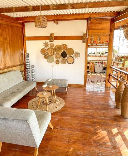 a living room with a couch and a table at Terrazas Iguana in Máncora
