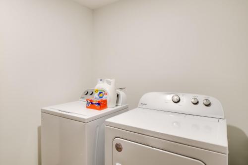 a kitchen with a white refrigerator and a stove at 5 Mi to Main St Breck Mtn-View Duplex with Hot Tub in Blue River