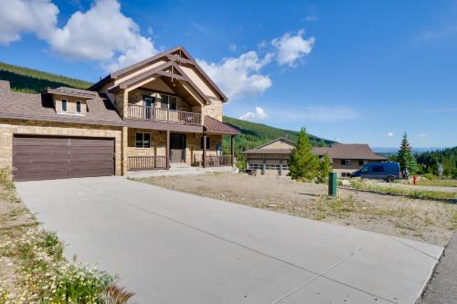 a house with a garage and a driveway at 5 Mi to Main St Breck Mtn-View Duplex with Hot Tub in Blue River