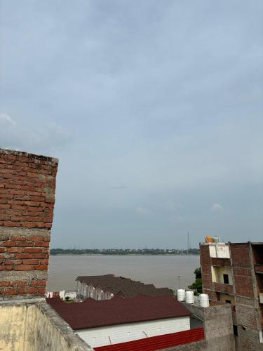 a view of the water from a building at Hotel Atharv in Varanasi