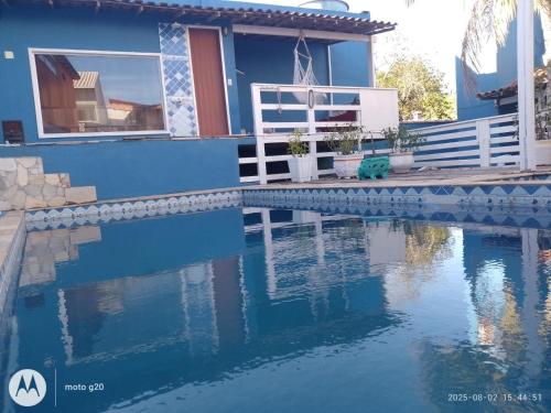 a house with a swimming pool in front of it at La Casa Agus Hospedagem in Búzios