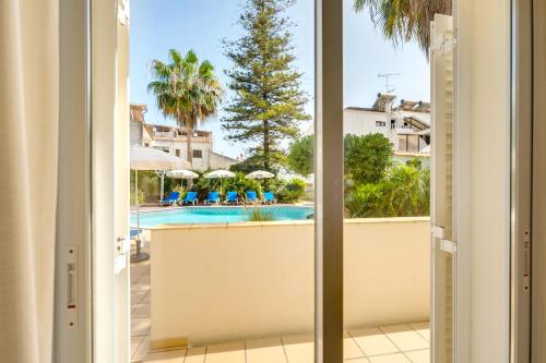 a view from the balcony of a hotel with a swimming pool at Muthu Clube Praia da Oura in Albufeira