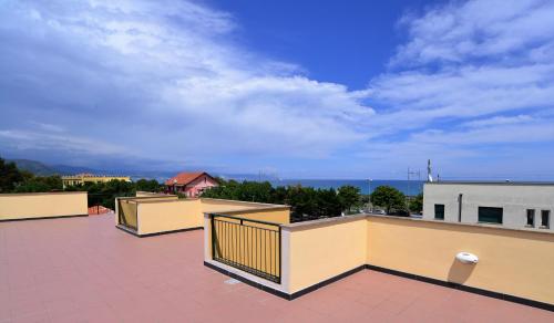 a balcony of a building with a view of the ocean at Residence Borgomare in Albenga