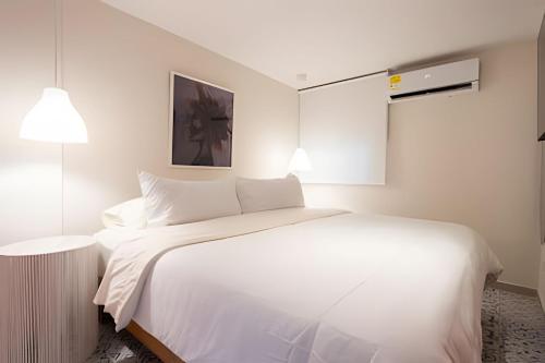 Postel nebo postele na pokoji v ubytování Marmulata Rooms