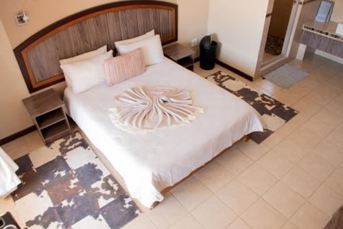 Ένα ή περισσότερα κρεβάτια σε δωμάτιο στο Goba Lodge & Rest Camp