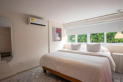 Postel nebo postele na pokoji v ubytování Marmulata Rooms