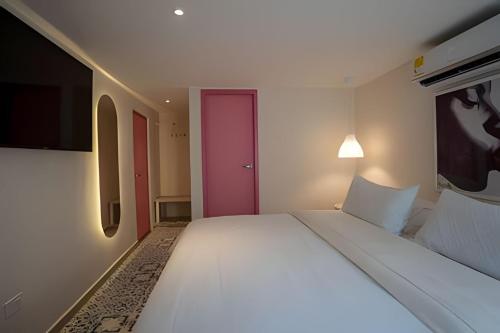 Postel nebo postele na pokoji v ubytování Marmulata Rooms