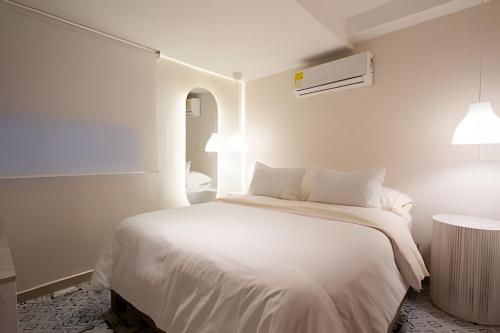 Postel nebo postele na pokoji v ubytování Marmulata Rooms