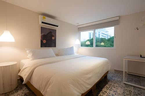 Postel nebo postele na pokoji v ubytování Marmulata Rooms