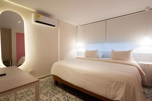 Postel nebo postele na pokoji v ubytování Marmulata Rooms