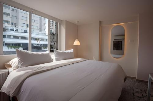 Postel nebo postele na pokoji v ubytování Marmulata Rooms