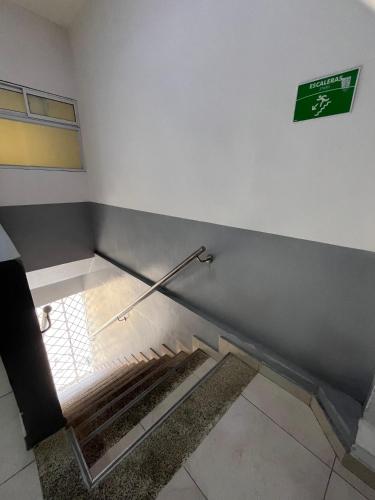 a empty room with a empty floor with a sign on the wall at Hotel Santa Marta VIP in Santa Marta