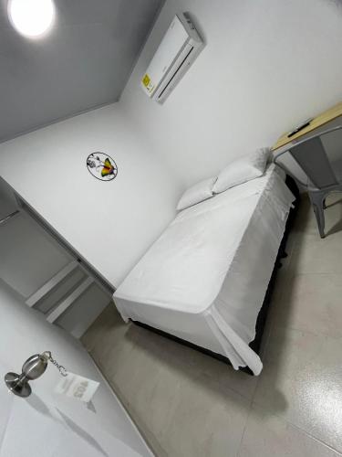 a large white bed in a hospital room at Hotel Santa Marta VIP in Santa Marta
