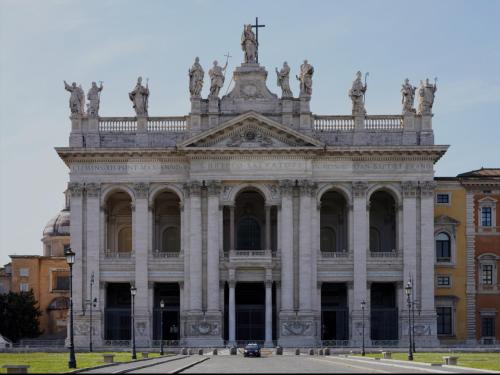 a large building with statues on top of it at Wow Rome Home in Rome