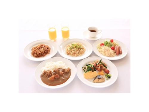 a group of plates of food on a table at Smile Hotel Shimonoseki - Vacation STAY 12507v in Shimonoseki