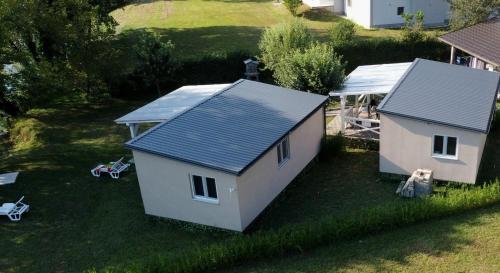 an overhead view of a house with a blue roof at Unatime.Krupa in Bosanska Krupa