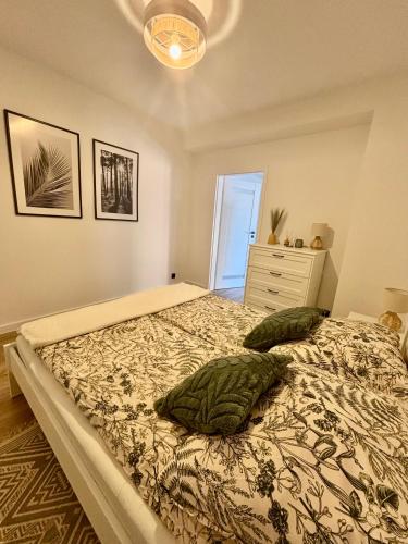 a bedroom with a bed with two pillows on it at Apartament pod Świerkami in Pisz