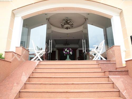 a set of stairs leading up to a house at Hoa Phat Hotel & Apartment in Ho Chi Minh City