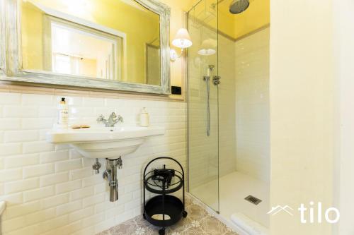 a bathroom with a sink and a shower at Villa Aranci | Historical Residence | By Tilo Lux in Genova