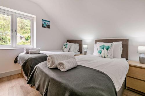 Voodi või voodid majutusasutuse Porthcothan toas